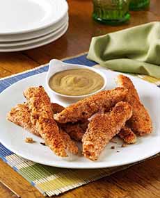 A Plate Of Almond Crusted Chicken Strips