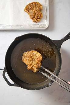 Frying Chicken Fried Steak In A Heavy Pan