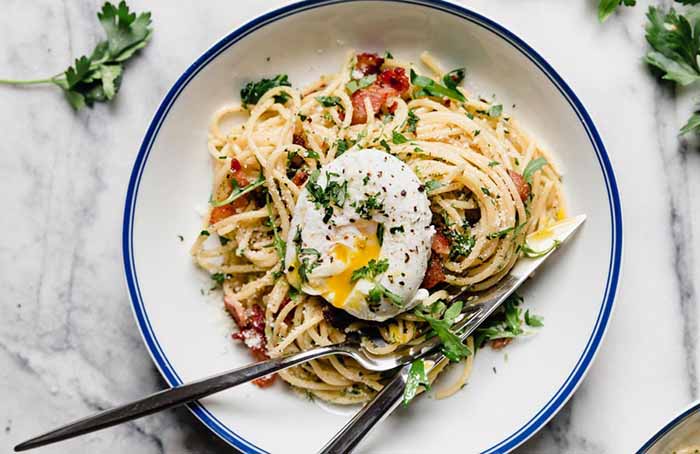 Spaghetti Carbonara Topped With A Poached Egg