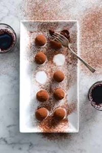 Chocolate Truffles With A Glass Of Red Wine