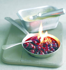 A dish of flaming Cherries Jubilee.