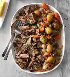 A Platter Of Pot Roast With Carrots & Potatoes