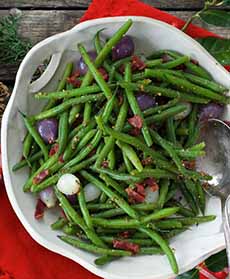 A bowl of Green Bean Salad With Pearl Onions & Bacon, with bacon vinaigrette
