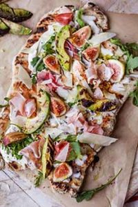 Grilled Pizza Topped With Avocado, Fig, & Prosciutto