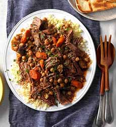 A Plate Of Pot Roast With Carrots & Rice