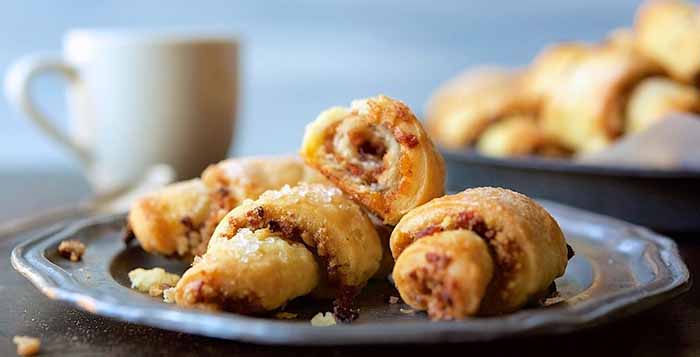 A Plate Of Rugelach With A Cup Of Coffee