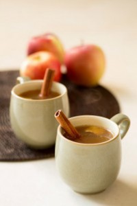 Apple Hot Toddy in a mug with a cinnamon stick.