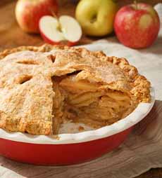 An Apple Pie With A Big Slice Cut Out Of It