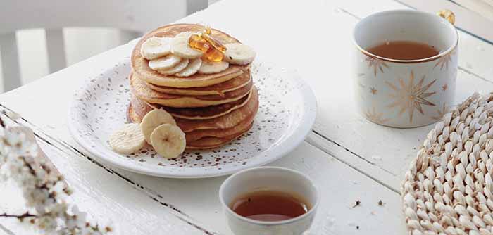 Pancakes With Sliced Bananas & Maple Syrup