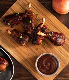 Barbecue Pig Wings with a side of barbecue sauce.