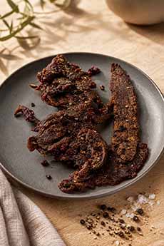 A Plate Of Black Pepper & Sea Salt Jerky
