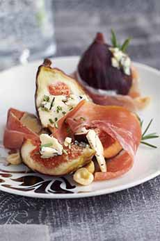 An Appetizer Plate Of Blue Cheese, Figs, & Prosciutto