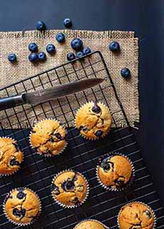 Just Baked Blueberry Muffins On A Wire Rack