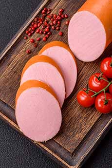 Slices of bologna on cutting board