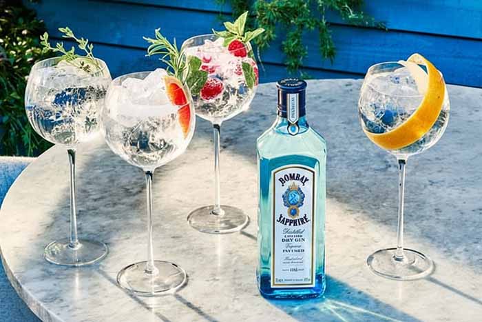 A bottle of Bombay Sapphire gin with cocktails