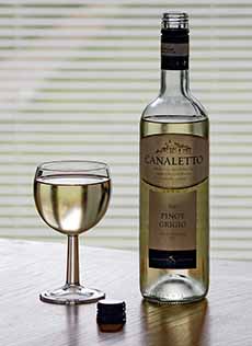 Glass and bottle of Pinot Grigio.