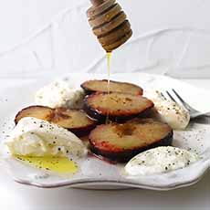 Burrata cheese with peaches and honey drizzle