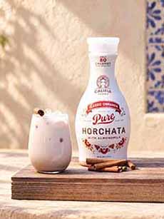 A bottle and glass of Califia Farms horchata.
