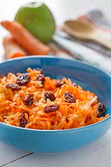 Carrot Raisin Salad in a blue bowl