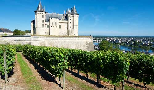 Saumur castle and Loire River, Loire Valley, France.