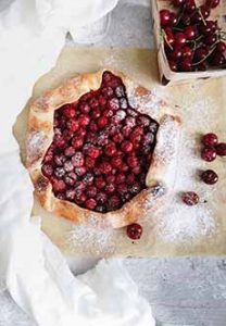 A Cherry Galette, a rustic pie made without a pie pan. The crust is folded up by hand over the filling.