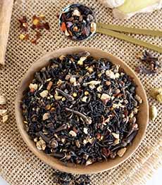 A dish of loose Chimayo Chai tea blend with hot peppers,