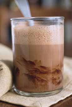A glass of chocolate milk.