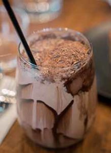 Glass Of Chocolate Milk With Shaved Chocolate Garnish