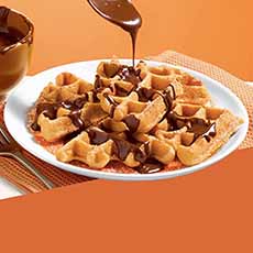 A Plate Of Krusteaz Churro Waffles With Chocolate Sauce