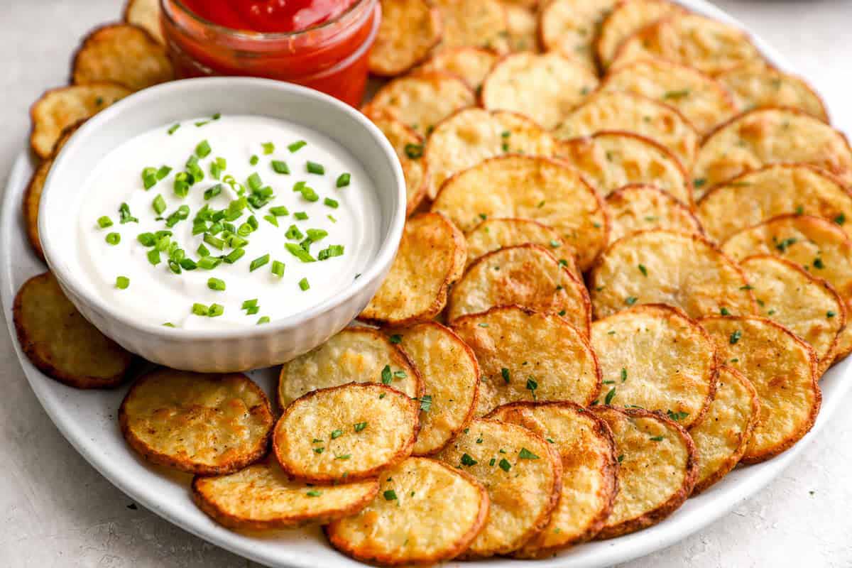 A Plate Of Cottage Fries With Dip