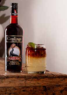 Dark n Stormy Cocktail With A Bottle Of Goslings Black Seal Rum