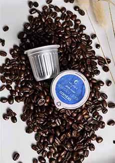 Cambio Aluminum K-Cups Shown With Whole Coffee Beans