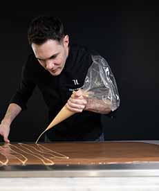 Piping A Zigzag On A Slab Of Dubai Chocolate