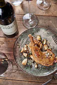 Roast duck with a bottle of Ridge Zinfandel.