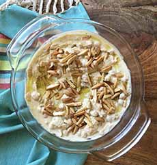 A bowl of Fattet Hummus, pudding style