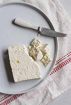 Block Of Feta Cheese With Knife