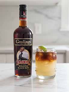 Dark n Stormy Cocktail With A Bottle Of Goslings Black Seal Rum