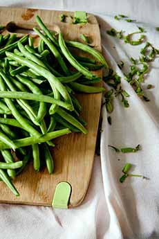 Raw Green Beans On A Cutting Board