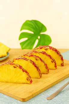 Rubyglow Pineapple Sices On A Cutting Board