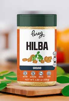 A bottle of ground hilba spice, aka fenugreek.