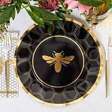 A disposable dinnerplate with a honeybee design