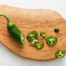 Sliced Jalapeno Chile On A Wood Board