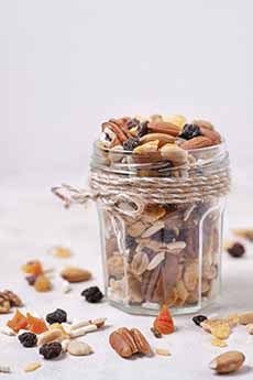 A jar of mixed nuts and dried fruits