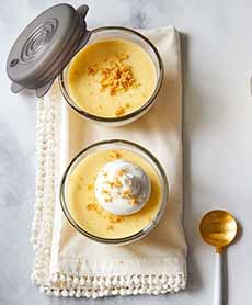 Two glass dessert bowls of Key lime pudding.