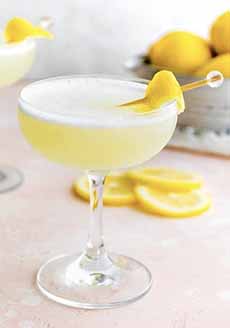 A Lemon Drop Martini with a lemon peel garnish.