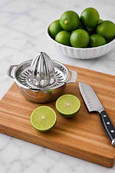 Plate Of Limes & Juicer