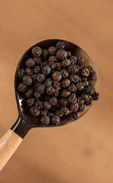 A Spoonful Of Madagascar Black Peppercorns