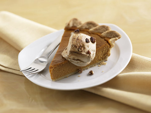 Slice Of Pumpkin Pie With Toasted Marshmallow Garnish
