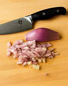 Minced Shallots On Cutting Board