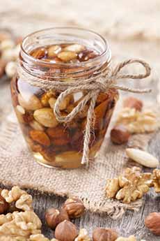 Mixed Nuts In A Jar Of Honey